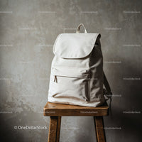 Minimalist White Backpack on Wooden Stool in Rustic Space