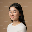 Young Woman with Glasses Smiling in Studio Portrait