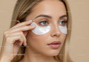 Young Woman Applying Under Eye Gel Patches for Skincare Routine