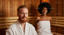 Relaxing Sauna Session With Smiling Man and Woman in Towels