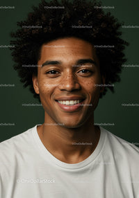 Bright Young Man with Curly Hair and Warm Smile in Studio Portrait