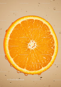 Fresh orange slice with water droplets on beige background