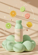 Natural supplement bottle surrounded by vibrant citrus slices