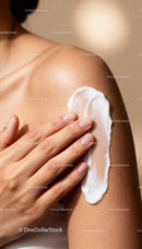 Applying moisturizing cream on smooth shoulder skin