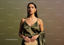 Elegant Woman in Satin Dress with Accessories in Outdoor Summer Setting