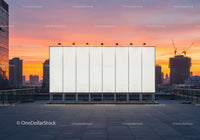 City Skyline with Construction Cranes and Sunset Sky
