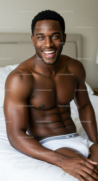 Smiling young man sitting on bed in white underwear
