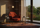 Cozy modern armchair corner by large window with sunset