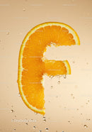 Fresh orange slice shaped like euro symbol in water