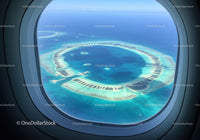 Aerial View of Circular Coral Atolls in Clear Blue Ocean