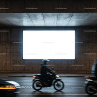 Blurred Motorcycle Riding Past Empty Urban Billboard at Night