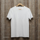 Plain white t-shirt hanging on wooden background