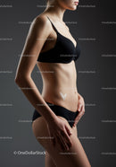 Elegant Woman in Black Lingerie with Toned Physique in Studio
