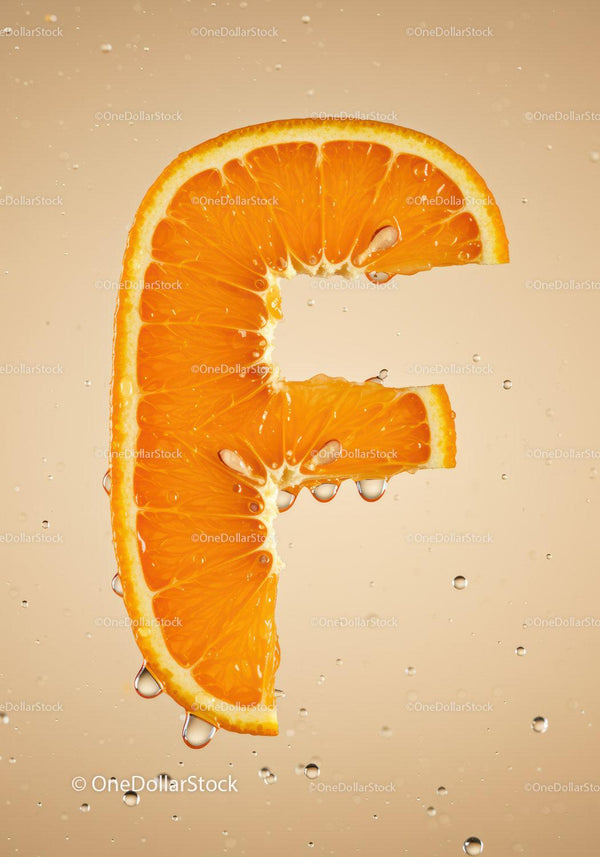 Fresh Orange Slice Shaped Like Letter F with Water Drops