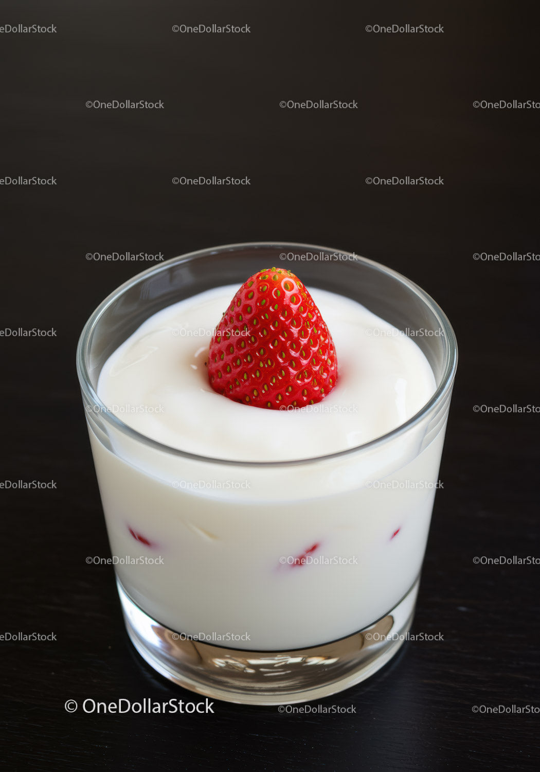 Creamy Yogurt with Fresh Strawberry on Dark Surface