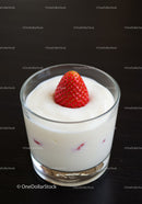 Creamy Yogurt with Fresh Strawberry on Dark Surface