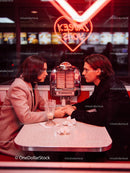 Couple Sharing Intimate Moment in Retro Diner