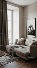 Cozy beige sofa corner with cushions and window light