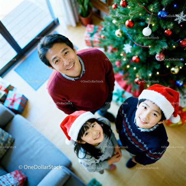Family Smiling Together by Christmas Tree at Home