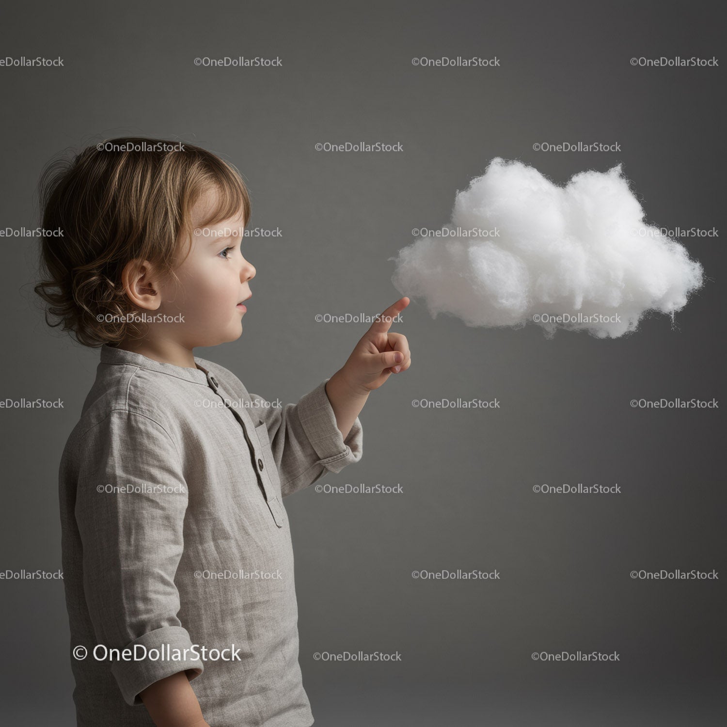 Curious toddler reaching out to a fluffy white cloud