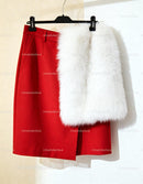Red skirt paired with luxurious white faux fur vest