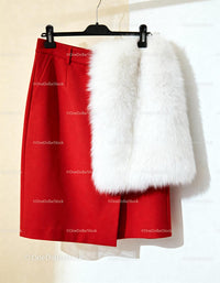 Red skirt paired with luxurious white faux fur vest