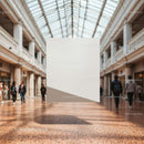 Modern Shopping Mall Interior with Glass Roof and Pedestrians