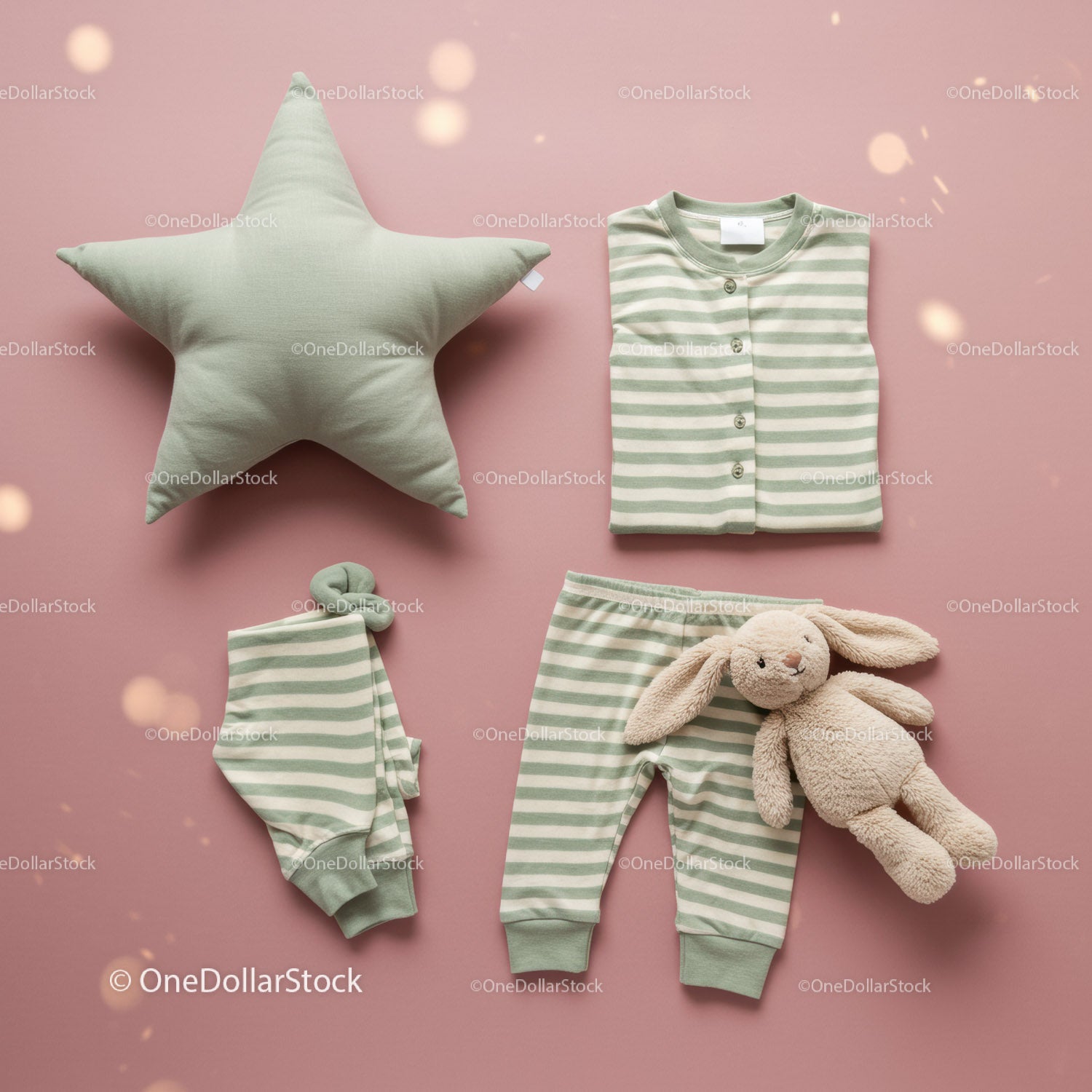 Soft green striped baby pajamas with plush bunny on pink
