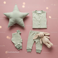 Soft green striped baby pajamas with plush bunny on pink