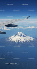 Aerial View of Mount Fuji with Airplane Wing and Blue Sky
