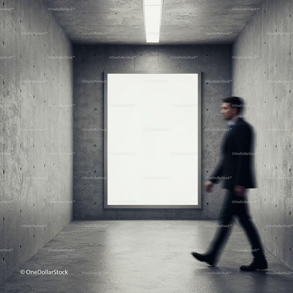 Blurred man walking past blank billboard in concrete room JPG Mockup Image