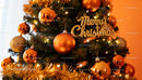 Festive Christmas tree decorated with golden ornaments