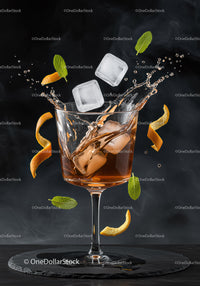 Refreshing cocktail with ice splash and citrus zest