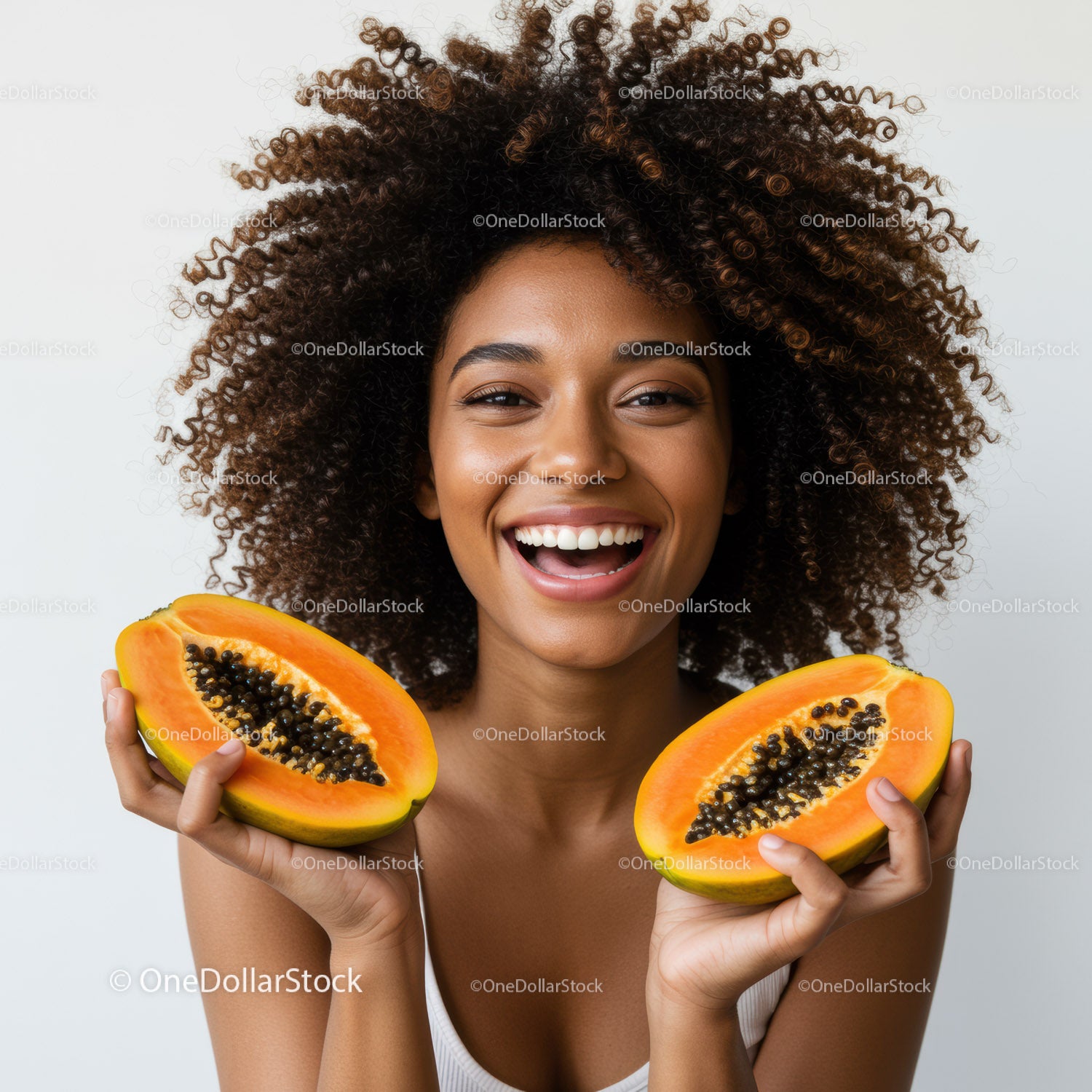 Happy Woman Holding Fresh Halves of Papaya with Curly Hair