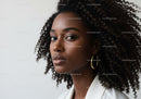 Elegant Black Woman with Curly Hair in a Professional Headshot