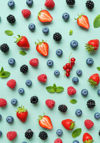 Fresh Mixed Berries and Mint Leaves on Blue Background