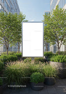 Blank billboard surrounded by lush urban greenery