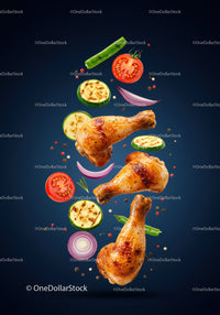 Grilled chicken drumsticks with fresh vegetables floating