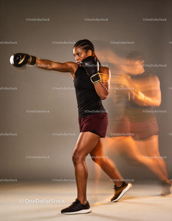 Female boxer delivering a powerful straight punch