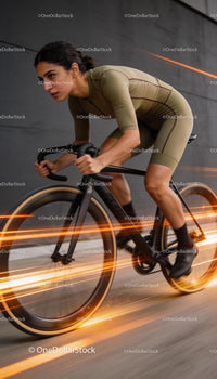Focused cyclist riding fast on urban street