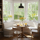 Cozy breakfast nook with natural light and flowers