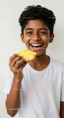 Smiling Boy Holding Pineapple Showing Joy with Tropical Fruit