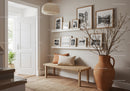 Cozy minimalist hallway with wooden bench and decor