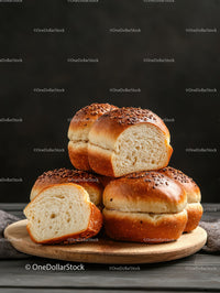 Freshly Baked Sesame Seed Bread Rolls on Wooden Board