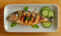 Fresh Grilled Fish with Cucumber Slices on White Plate Food Image