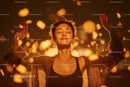 Serene Woman Meditating with Golden Glow and Floating Confetti