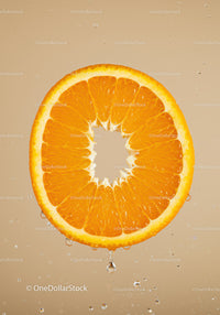Fresh orange slice with water droplets on beige background