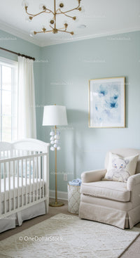 Elegant Baby Nursery with Armchair and Floral Wall Art in Soft Pastels