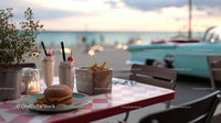 Seaside outdoor cafe with milkshakes fries and burger overlooking the ocean