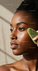 Young Woman with Glowing Skin Using Green Facial Massage Stone